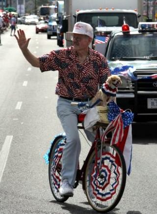 Charlie Hooten and his dog Honey rode along during the 12th Annual Westside Indpendence Day Parade Saturday.